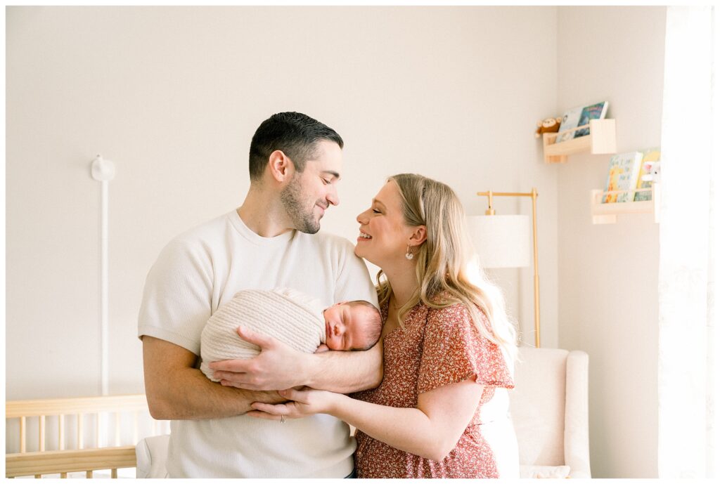 New Jersey lifestyle newborn photographer capturing natural moments between parents and baby at home