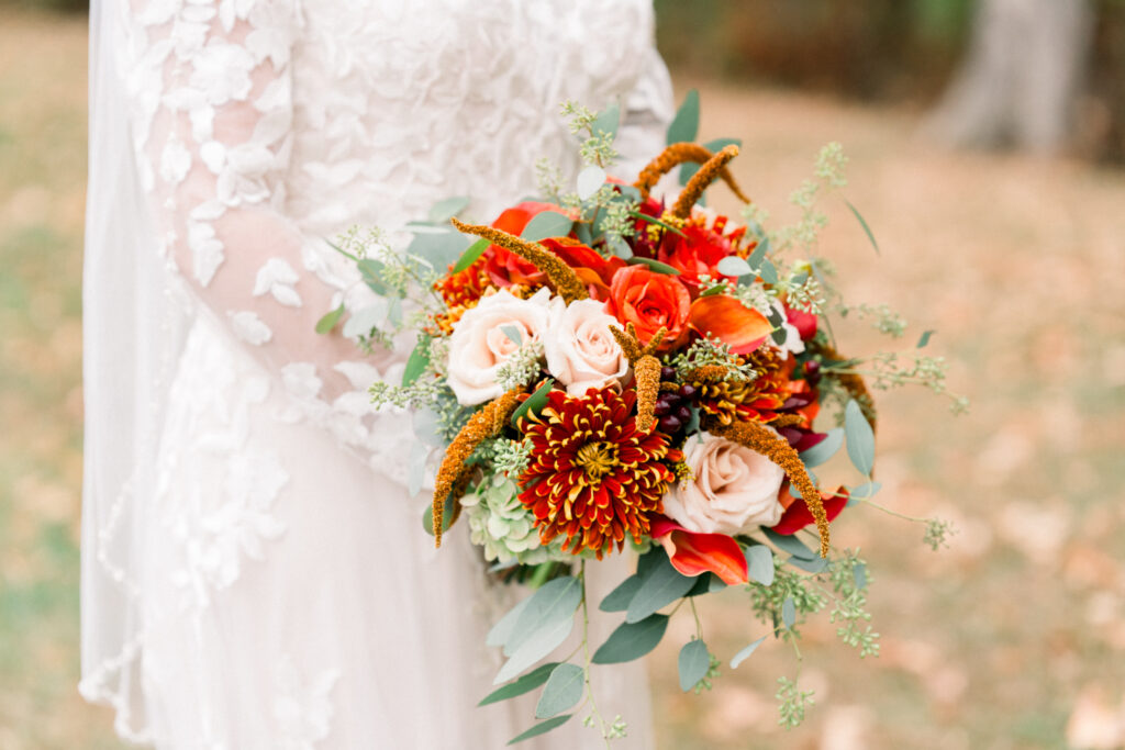 Romantic fall bouquet in autumnal colors. Oranges, rusts cream for a fall wedding. Renee Ash Photography.