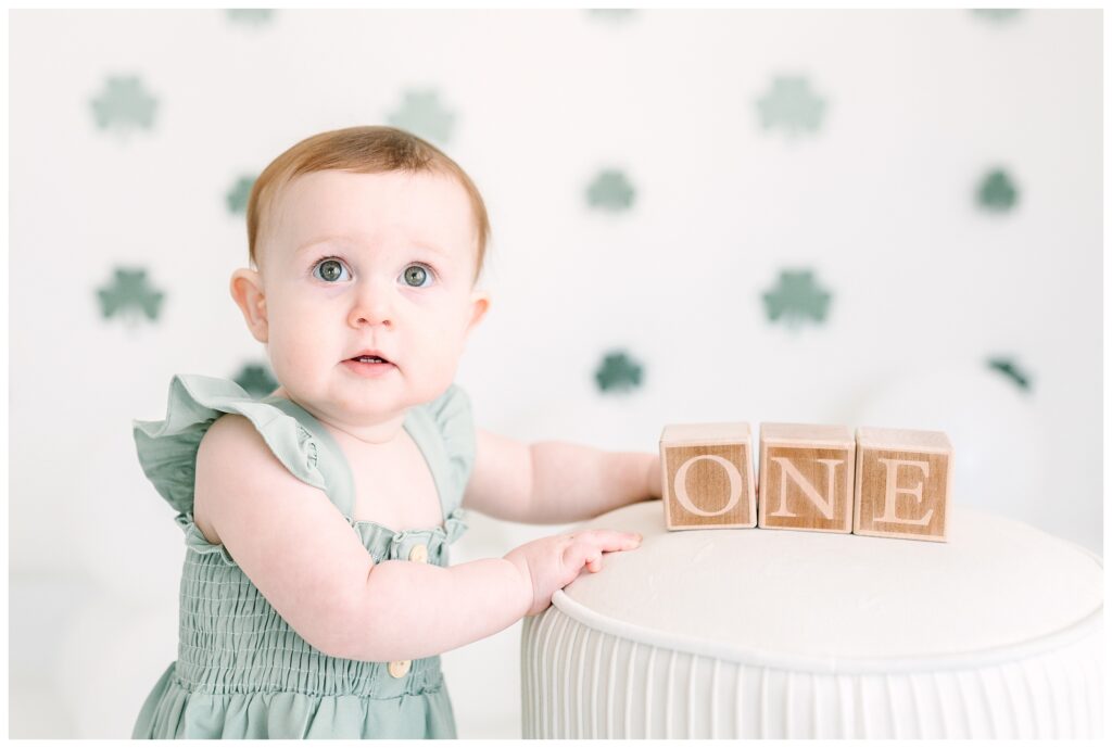 sweet little Irish lass with red hair and the greenest eyes as your star of the day! At my natural light studio in Lafayette, NJ, cake smash sessions are relaxed, fun, and beautifully styled to let your baby’s personality shine.