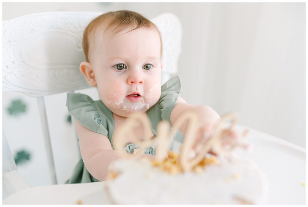 sweet little Irish lass with red hair and the greenest eyes as your star of the day! At my natural light studio in Lafayette, NJ, cake smash sessions are relaxed, fun, and beautifully styled to let your baby’s personality shine.