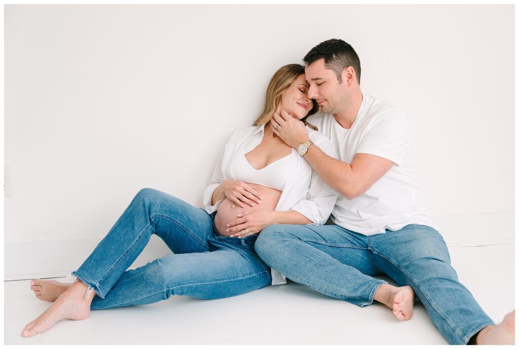 Modern studio maternity photo in Sussex County NJ with white button down shirt, bralette and jeans