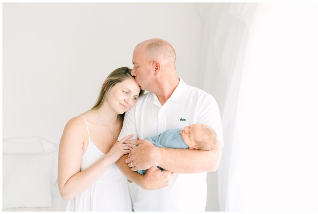 parents holding newborn baby photography nj