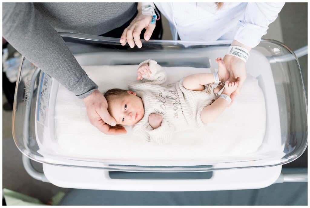 Baby boy in the hospital bassinet in the hospital after delivery at Morristown Medical Center during baby's first photo shoot with Fresh 48 Newborn Photographer renee Ash Photography