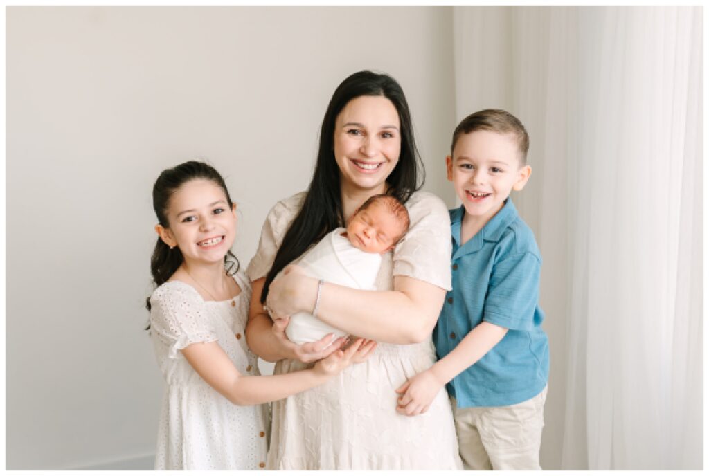 Mother and children photographer for mothers day in north new jersey Newborn Photography in North New Jersey | Natural Family Studio Session with Siblings white and blue wardrobe minimal simple styling