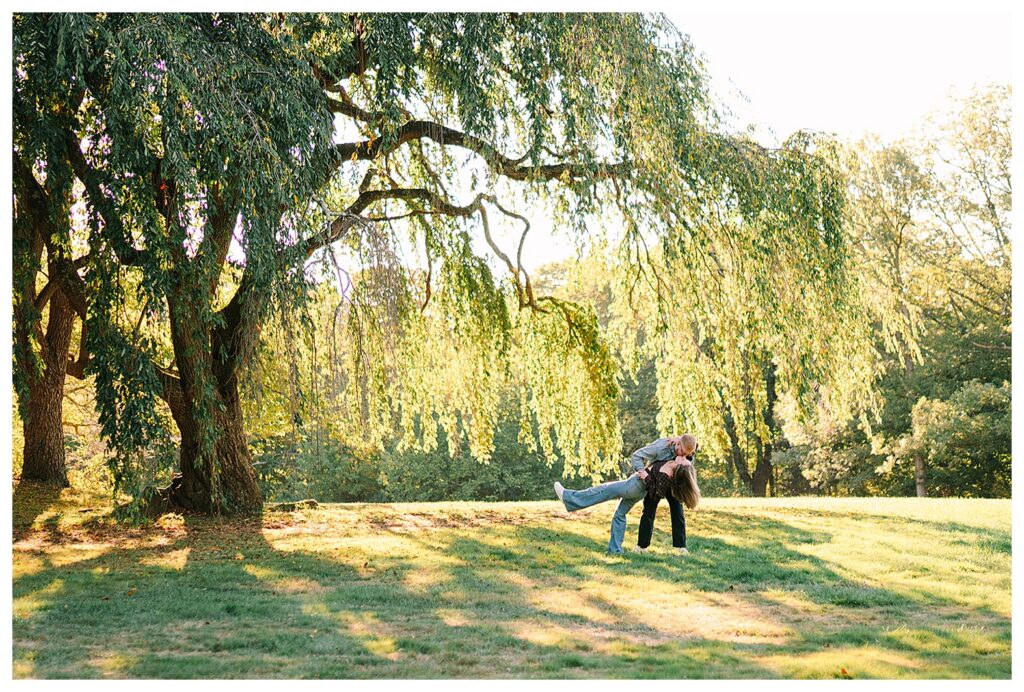 Golden hour engagement portraits at Skylands Manor with a couple walking through open fields and botanical gardens in Ringwood NJ.
Romantic engagement session at Skylands Manor castle gardens with a happy couple laughing together in beautiful summer sunlight.
Bright true to life engagement photos in North NJ featuring a couple dancing and cuddling in the gardens at Skylands Manor.
Summer engagement photography at New Jersey Botanical Gardens with colorful flowers glowing in sunset light around a joyful couple.
Relaxed candid engagement photos at Skylands Manor showcasing a couple twirling and laughing together in golden evening sunlight.
Elegant yet natural engagement portraits at Skylands Manor with a couple enjoying the gardens and castle inspired architecture in North Jersey.
Couple holding hands and walking through the flower gardens at Skylands Manor during a romantic North New Jersey engagement session.
Fun and easy engagement photo session at Skylands Manor featuring natural candid moments, sunset light, gardens, and beautiful open fields in NJ.